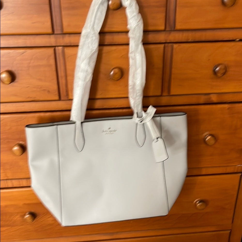 Brand new with tags, Kate Spade Saffiano leather bag in platinum gray.